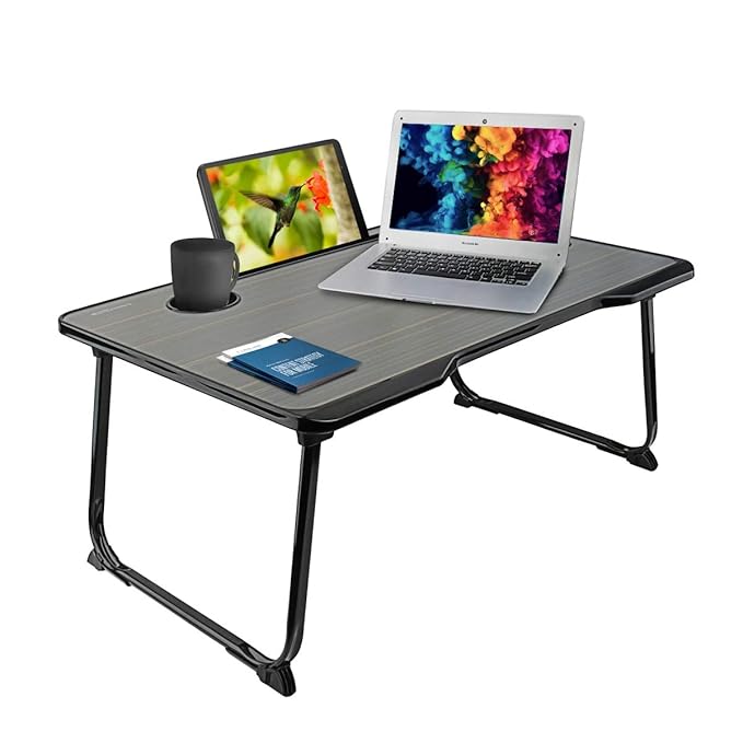 Multifunctional Folding Table Features Multifunctional folding table for work and study Built-in cup holder for convenience Dedicated mobile and tablet holder Ergonomic design for comfortable usage Lightweight and portable structure Foldable design for easy storage Spacious tabletop for laptops and accessories Suitable for bed, sofa, floor, and desk use Ideal for work-from-home, study, reading, and gaming